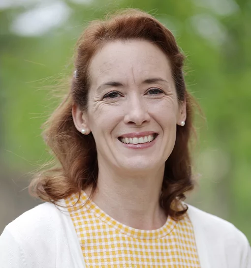 Elspeth Pitman, Head of Graduates: Placement, Employment and Alumni, and a Norland Nanny stood smiling